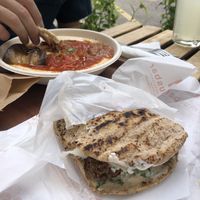 Pita falafel with whole wheat bread and hummus shakshuka bowl at Hummus Bar Vegetarian in Budapest