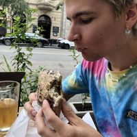 Happy guy with his pita at Hummus Bar Vegetarian in Budapest