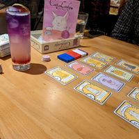Lavender mocktail with cat lady game at Snakes & Lattes - Bloor St in Toronto