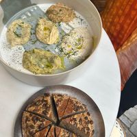 Gathering plate with different spreads and sourdough bread on the side  at Avit in Athens