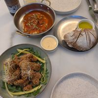 Calamari, sausage and hummus, portion bread at Avit in Athens