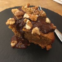 Carrot cake with chocolate sauce and walnuts at Las Vegan in Lisbon