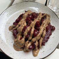 So this is half a portion of pancakes. This one topped with raspberry jam, cherries and almond butter  at Ćao Šećeru in Belgrade