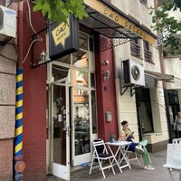 Seen from the outside. Cute place with outdoor seating on sidewalk  at Ćao Šećeru in Belgrade