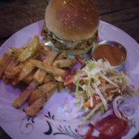 Veg vegan burger. The sauce is tahini. at Rest Point Cafe in Pokhara