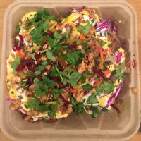 Papas Grande - 2 Large Organic Russets, Smokey Red Chili, NM green chili, Queso Vegano, Sour Cashew Cream, and all complementary toppings at Papas Hot Potatoes in Seattle