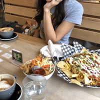 Vegan nachos and cauliflower wings  at Snakes & Lattes - College in Toronto
