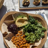 Plant Power bowl: Groats, crunchy chickpeas, kale, avocado, beetroot, black sesame,
nutritional yeast, tortilla, lemon dressing at Galini Cafe in Santorini