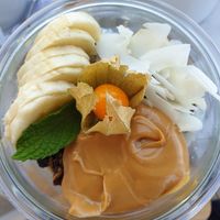 Porridge with dark chocolate granola, banana, and peanut butter at Galini Cafe in Santorini