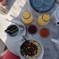   Vegan oatmeal bowl, juices, jams, and green tea.... at Galini Cafe in Santorini