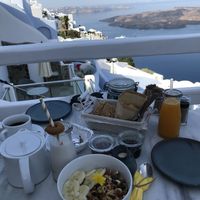 Vegan breakfast and a basket with pastries and bread.  at Galini Cafe in Santorini