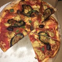 Vegan pizza parmigiana, with coconut cheese, eggplants, olives and tomato sauce at Pizza Street - Putuo District in Shanghai