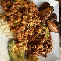 The Latin Plate with Jackfruit Pernil plantains beans rice and avocado   at Arles and Boggs  in Wallingford