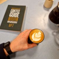 Flat white and breakfast tea  at Sacred Grounds in Exeter