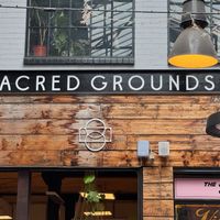 Restaurant sign at Sacred Grounds in Exeter