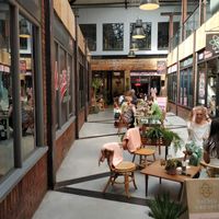 Outside tables in the alley at Sacred Grounds in Exeter