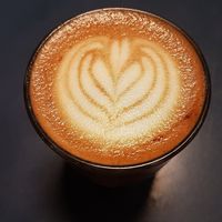 Oat Mylk Flat White at Sacred Grounds in Exeter