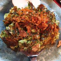 Veggie okonomiyaki with avocado and loads more with burnt carrot on top  at Yasai Izakaya Genki in Tokyo