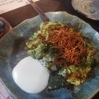 Okonomiyaki with avocado in it and carrots on the top at Yasai Izakaya Genki in Tokyo