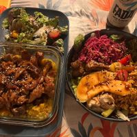 2 main dishes. On the left: seitan cooked yakitori style on top of a yam purée and grean peas! On the right: buddha bowl with rice, hummus, lettuce, broccolini etc! So good!  at La Cabane en Ville in Aix-en-provence