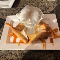  Fried banana with coconut ice cream. The toping is honey, so ask without if you want. at Yuma Thai Cuisine in Yuma