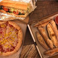 Veggie sub, pizza with vegan cheese and breadsticks  at Pizza Pronto Oakland in Pittsburgh