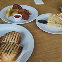 Sausage hash brown toastie with samosas, onion bhajis and Biscoff cake at The Ark in Northampton