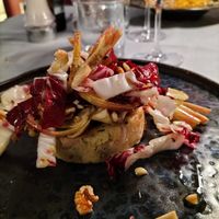 Mushroom and potato burger with radicchio and fresh artichokes at L'Escalier in Pecetto Torinese