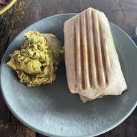 Breakfast burrito + guacamole. I gave up 1/2 thru, wouldn’t have gotten that far without purchasing the guacamole.  at Whyld Ass in Phoenix