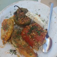 Gemista (stuffed tomato and stuffed pepper, served with some thickly cut fried potatoes and slices of vegan feta! (Probably Violife)  at Karma in Santorini