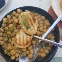 Delicious and comforting chickpea stew with perfectly toasted pitta  at Karma in Santorini