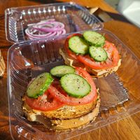 Spicy vegan bagel with baked tofu added at Influx Cafe - Little Italy in San Diego