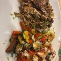 Marinated tempeh with sauted veggies at Estravagario in Bologna