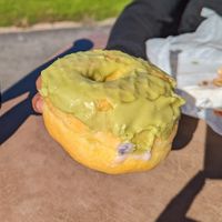 Green Tea donut..this photo doesn't do justice.. got a little damaged in transit. at Vegan Bistro in San Jose