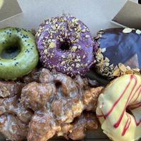 Matcha (not great), Blueberry Breakfast, Almond Coconut Filled, Apple Fritters (yum) and Hamilton Hurricane (super yum)  at Donut Monster in Hamilton