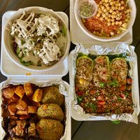 Clockwise from upper left: falafel salad, koshary bowl, zucchini boats, falafel platter at Koshary Corner in Clarksville