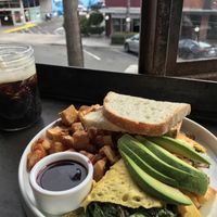 Harvest omelette with sour dough and like 500 potatoes. Oh, and cold brew coffee 🧡  at Breakfast Republic - Ocean Beach in San Diego
