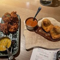 Onion pakora on left, samosa on right.  at Indie Indian Kitchen in Tromsoe