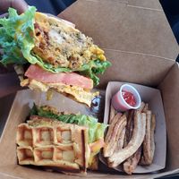 Chicken and waffle sandwich with waffle fries. at Beyond Vegan Cell Food in Portsmouth