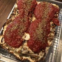 Custom made pizza with vegan cheese, vegan sausages, mushrooms and tomato sauce at Brigade Pizzeria in Montreal