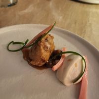 Pre-dessert

Spring onion, rhubarb, and apple beignet with garam masala – apple and
lapsang souchong glaze – labneh – smoked apple compote – sweet and sour rhubarb. at Bonboon in Amsterdam