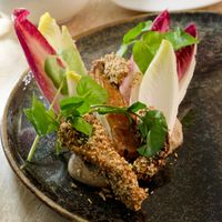 Intermediate: Fried oyster mushroom w/chicory cooked in Marmite butter at Bonboon in Amsterdam