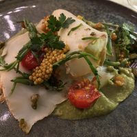 Smoked celeriac, blistered tomatoes, pickled mustard seeds, samphire and more  at Bonboon in Amsterdam