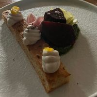 Focaccia met cashew crème, gerookte en ingelegde bietjes, cashew pesto  at Bonboon in Amsterdam