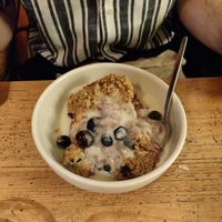 Vegan mixed fruit crumble with vegan custard at Bonnington Cafe in South West London