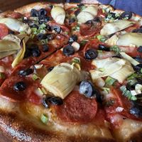 Vegan pepperoni and miyoko cheese substitution   at Creekside Pizza & Taproom in San Anselmo