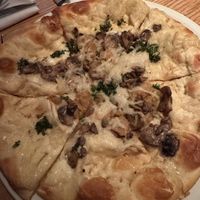 Mushroom and kale pizza with vegan cheese  at Earls in Denver