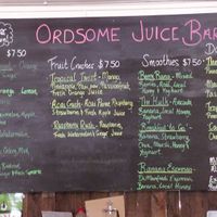 Menu board detailing juices and smoothies at Kimberley Cafe in Kununurra