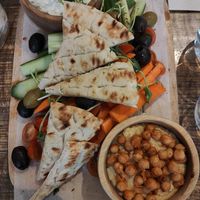 Appetizers like pita, hummus and tsatsiki sauce at The Urban Garden in Vilnius