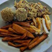 Peanut lentil dumplings with coleslaw and amazing sweet potato fries at Vegehop in Zagreb